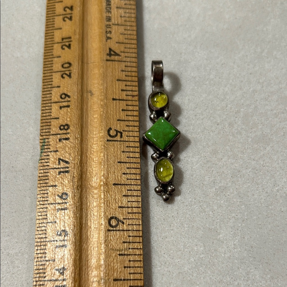 Silver and gem stone pendent.